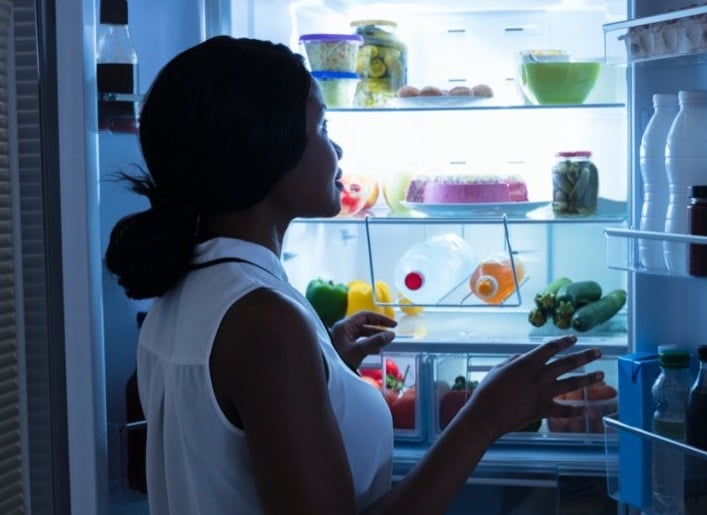 Woman eating late fridge 1024x683 1